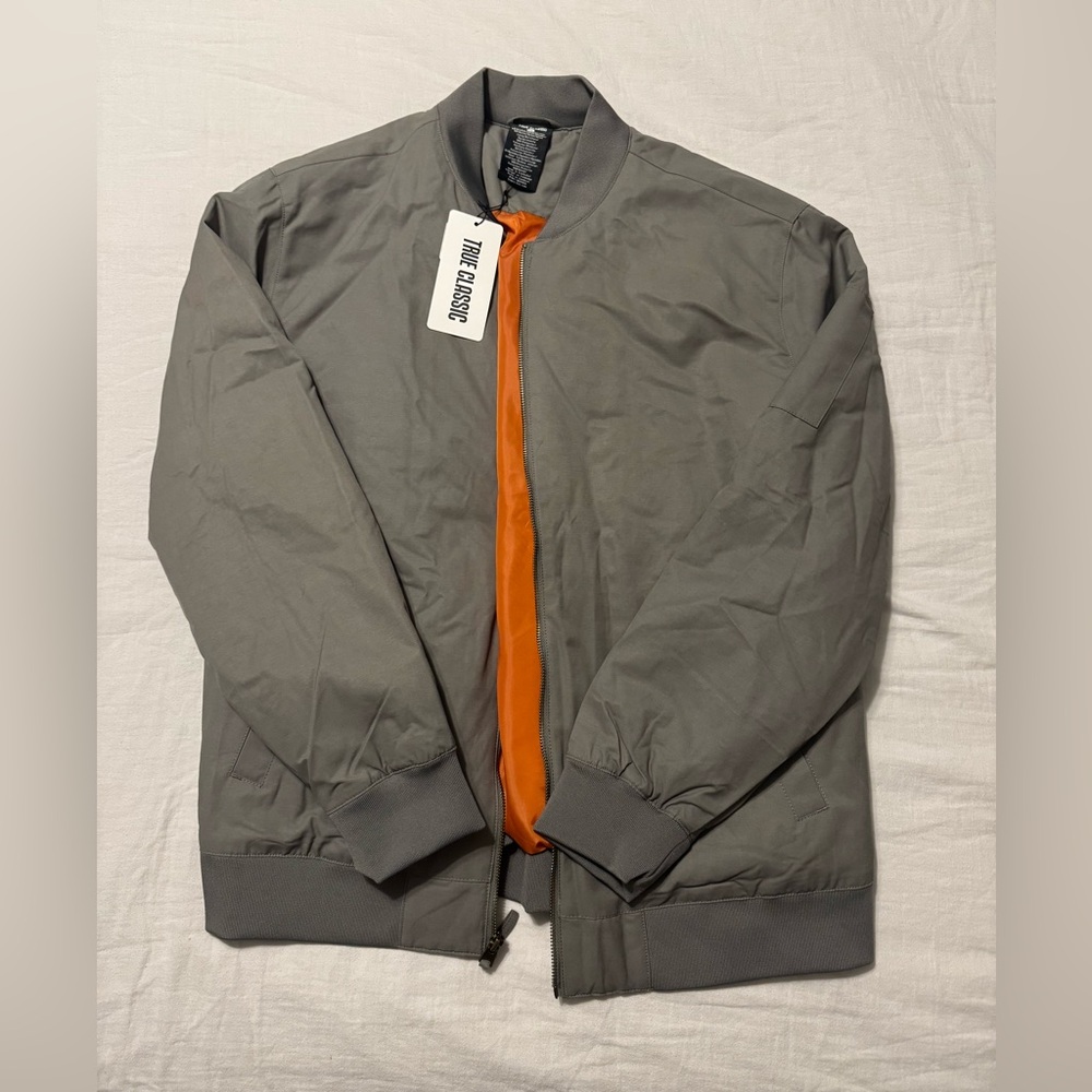 The Classic Men's Gray Bomber Jacket with Orange Lining